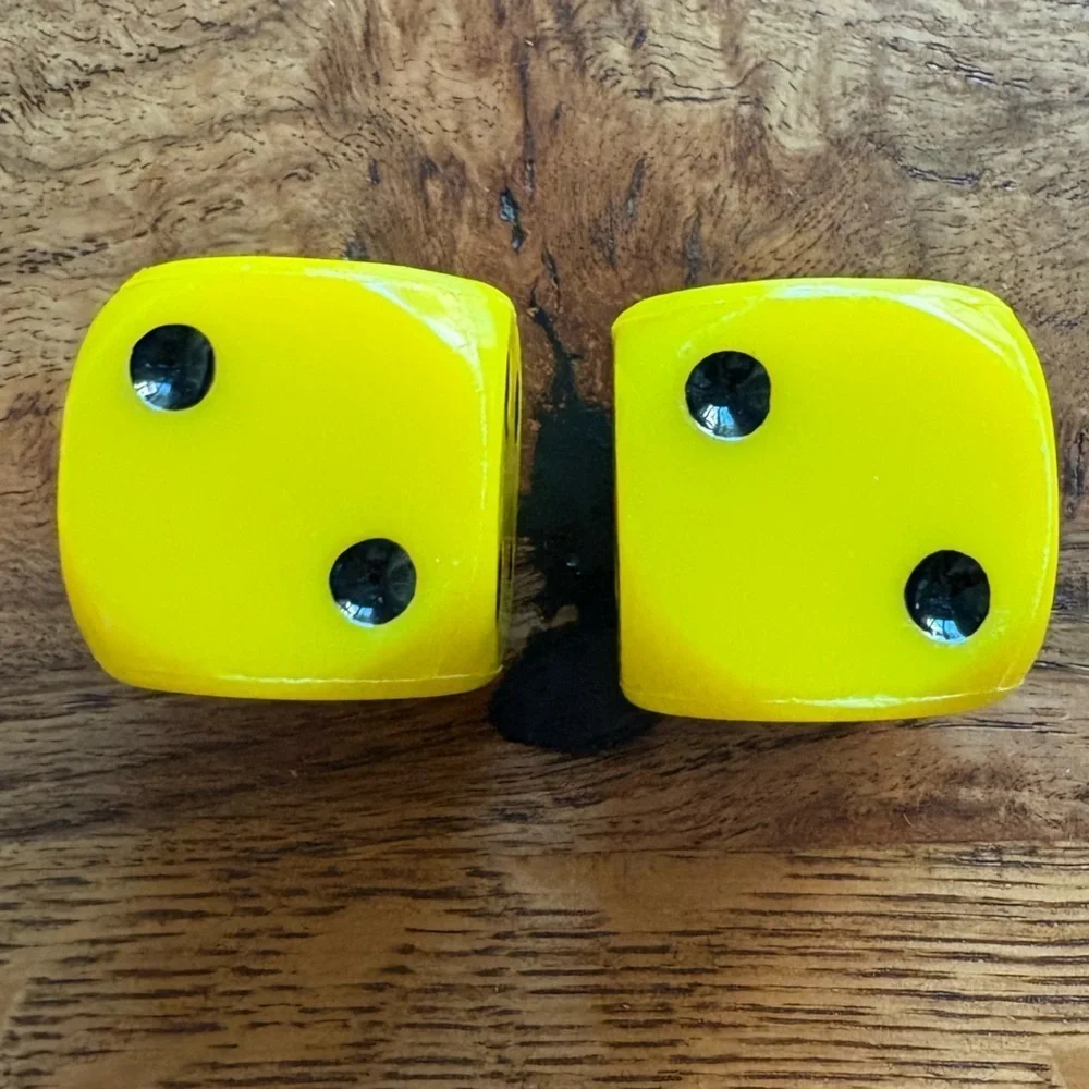 Vintage pair of yellow and black large dice